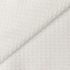 A Folded Close Up of a Waffle Kitchen Towel