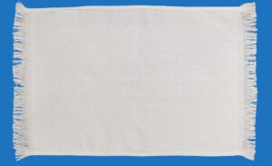A White Towel With Frilled Edges on Either Ends