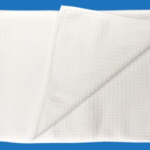 A White Folded and Textured Towel on Blue Background