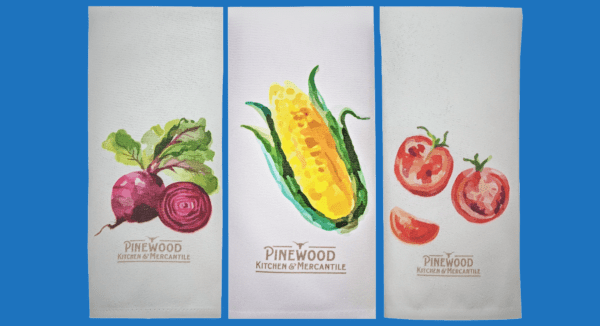 A Line of Three Vegetable Printed Towels