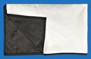 A White and Black Picnic Blanket Folded