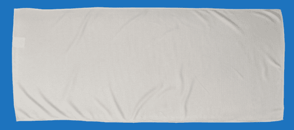 A White Color Towel Laid on a Blue Background